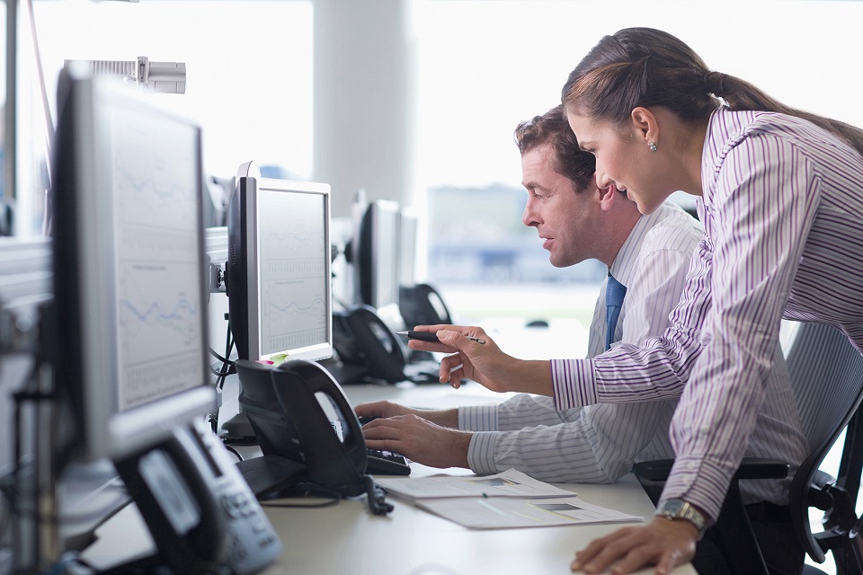Employees work on system integration