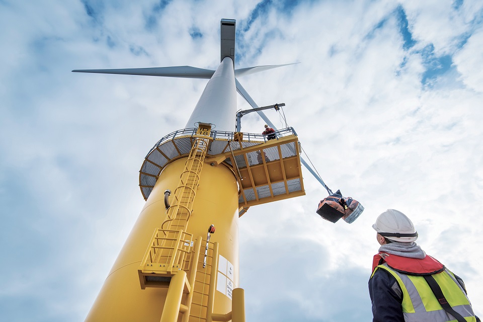Workers work on a new wind turbine
