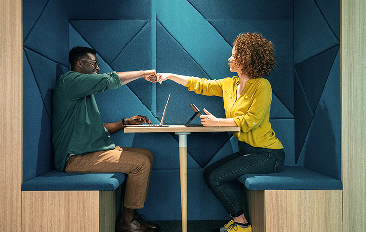 Specialisms Employees giving a fist bump